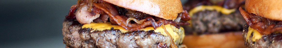 Eating Burger Gastropub at Salt Factory Pub restaurant in Alpharetta, GA.